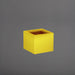 Antwerp Corner Fiberglass Planter in gloss saffron against gray background.