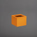 Antwerp Corner Fiberglass Planter in gloss tangerine against gray background.