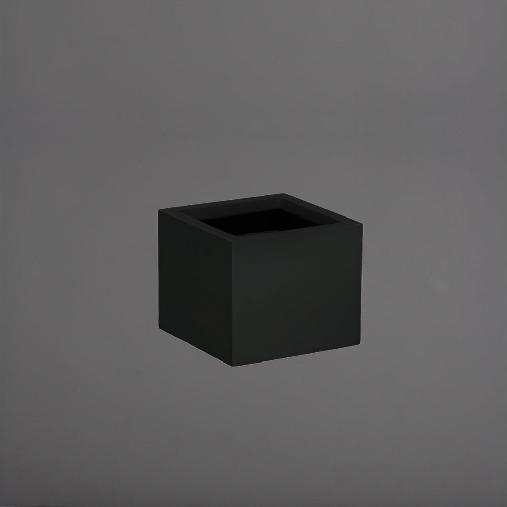 Antwerp Corner Fiberglass Planter in matte black against gray background.