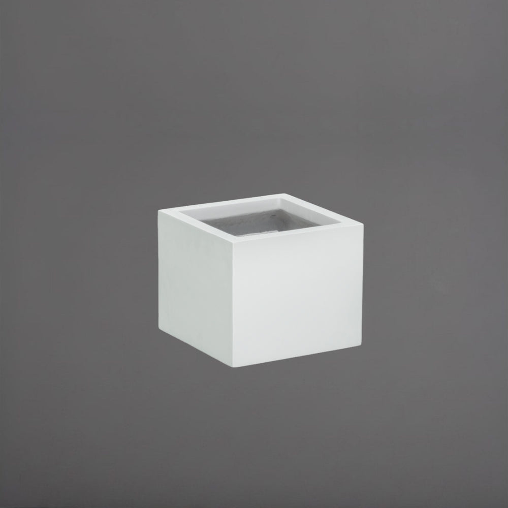 Antwerp Corner Fiberglass Planter in matte bright white against gray background.