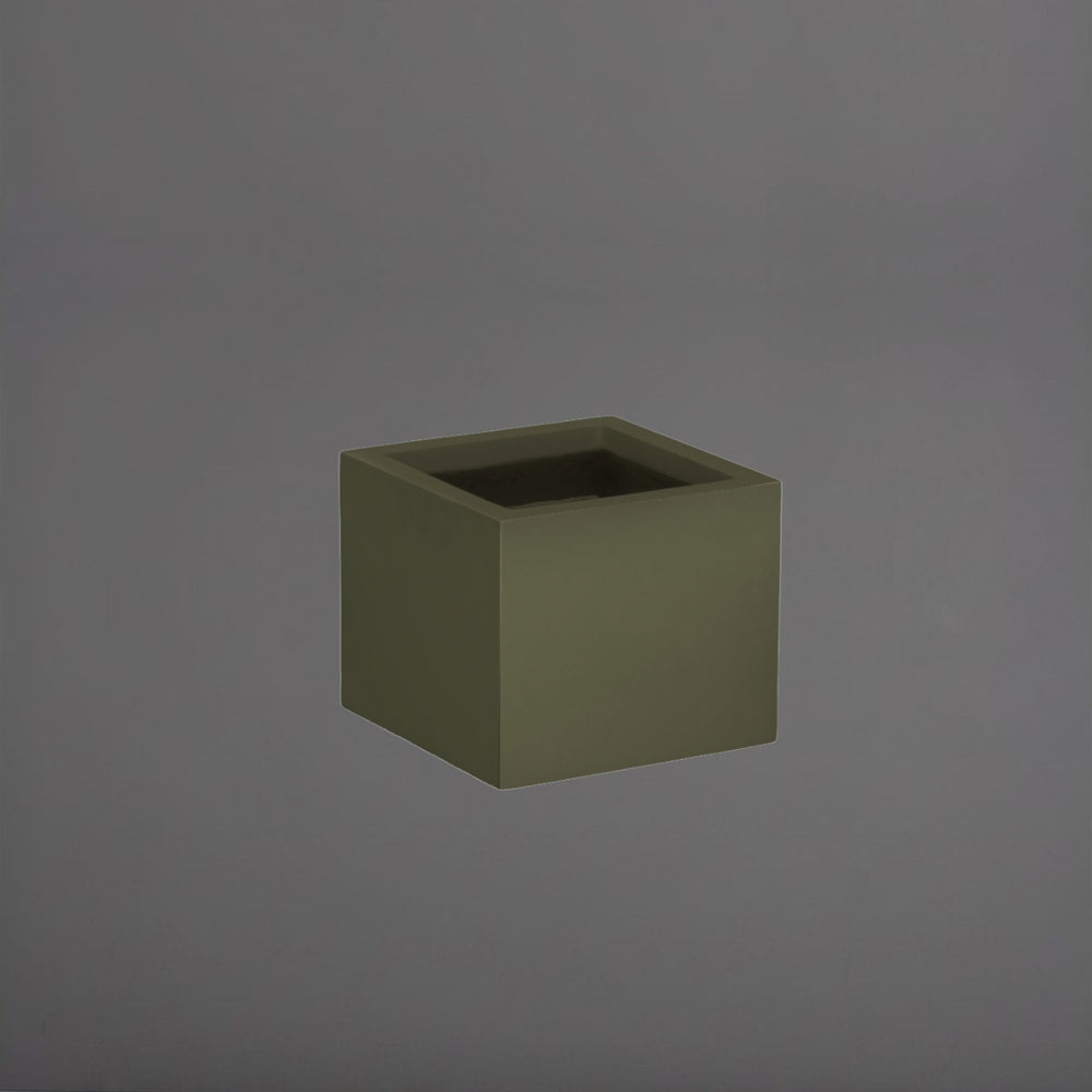 Antwerp Corner Fiberglass Planter in matte bronze against gray background.