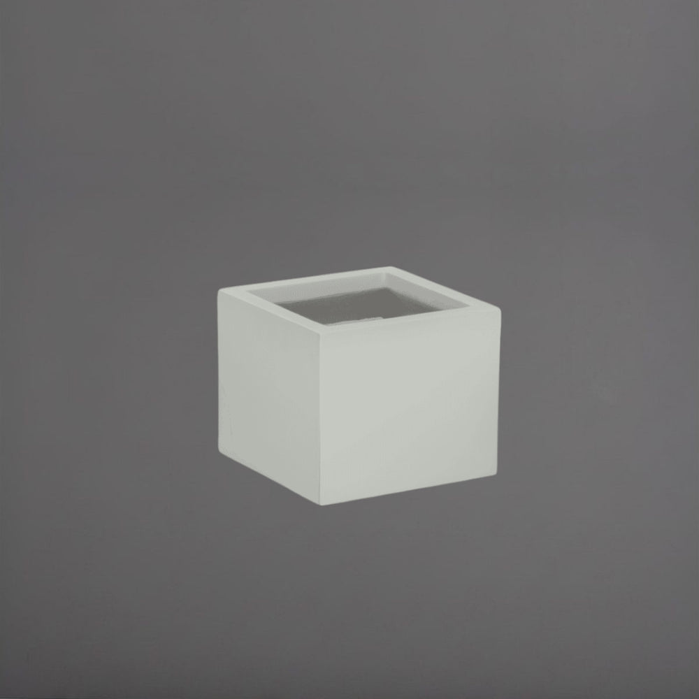 Antwerp Corner Fiberglass Planter in matte cement grey against gray background.