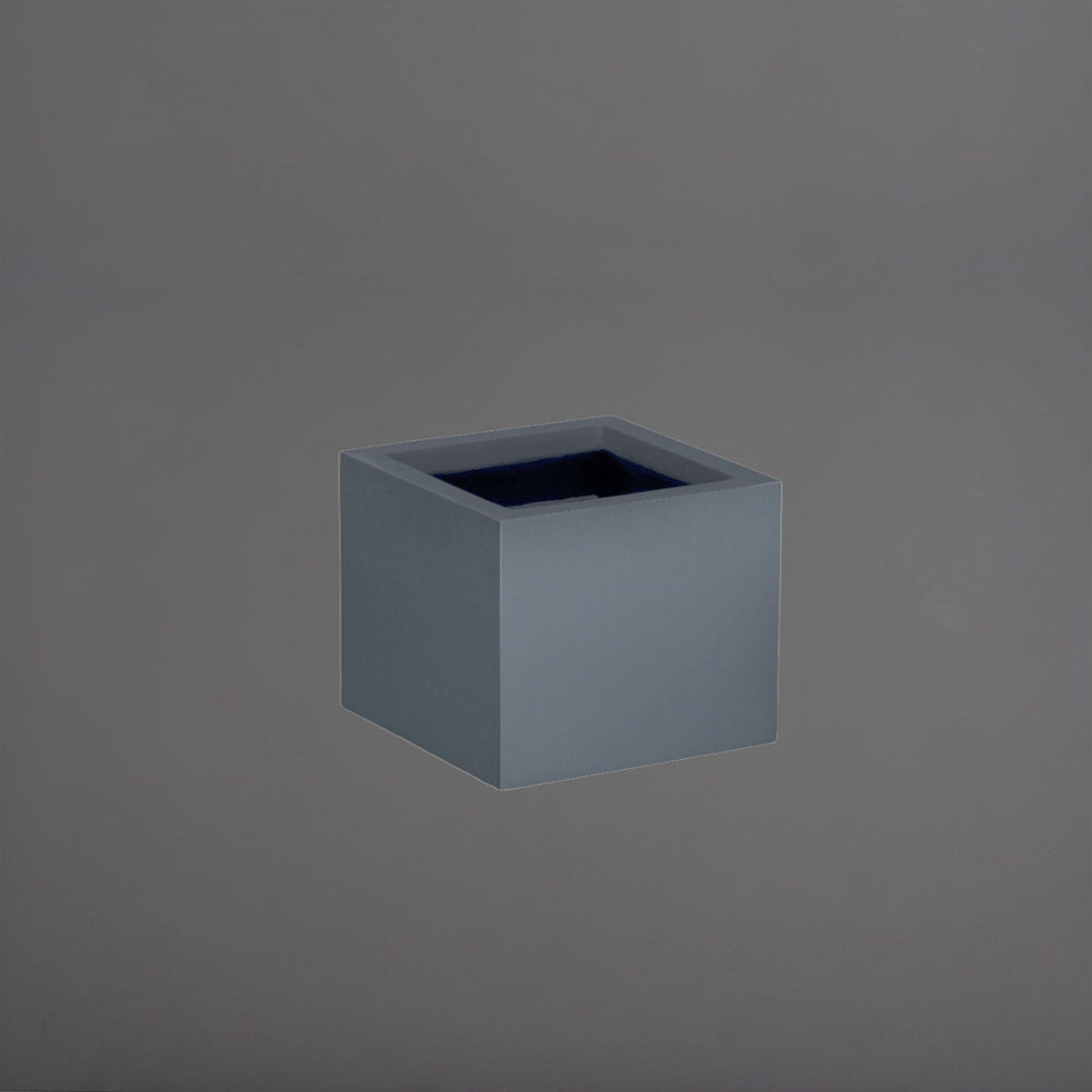 Antwerp Corner Fiberglass Planter in matte charcoal against gray background.