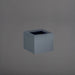 Antwerp Corner Fiberglass Planter in matte charcoal against gray background.