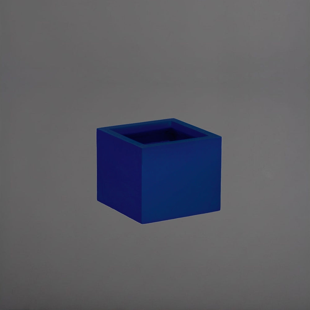 Antwerp Corner Fiberglass Planter in matte cobalt blue against gray background.