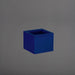 Antwerp Corner Fiberglass Planter in matte cobalt blue against gray background.