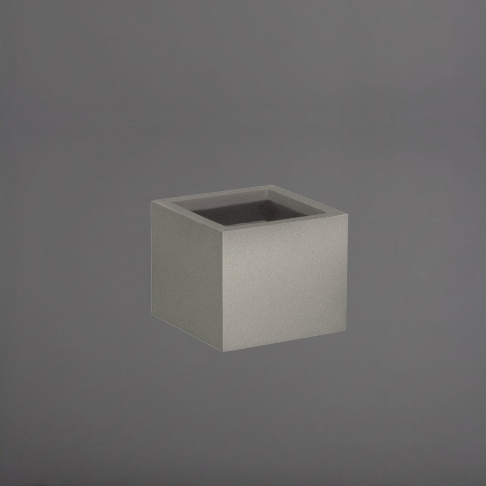 Antwerp Corner Fiberglass Planter in matte gunmetal against gray background.