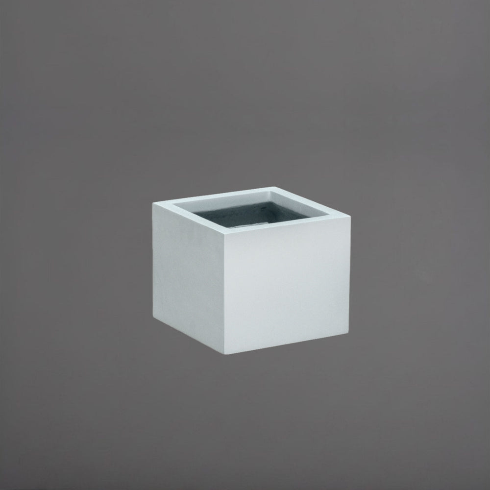 Antwerp Corner Fiberglass Planter in metallic silver against gray background.