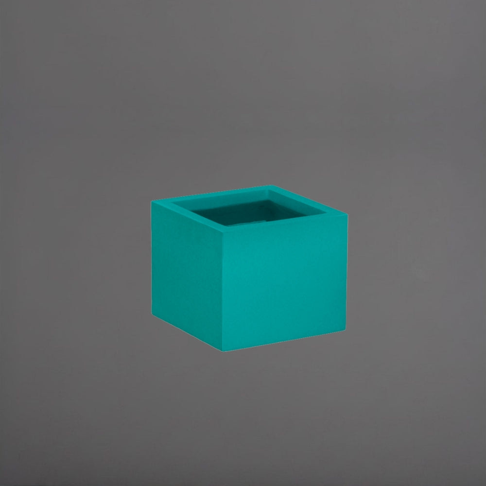 Antwerp Corner Fiberglass Planter in satin seafoam green against gray background.