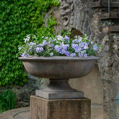 Apsley Urn Planter, Large filled with purple flowers in the backyard