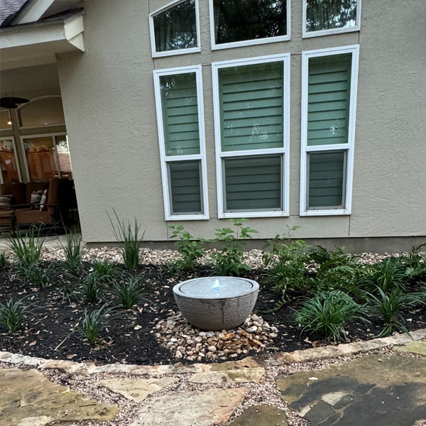 Arroyo Fountain - Stone Ledge, Large in action against house window