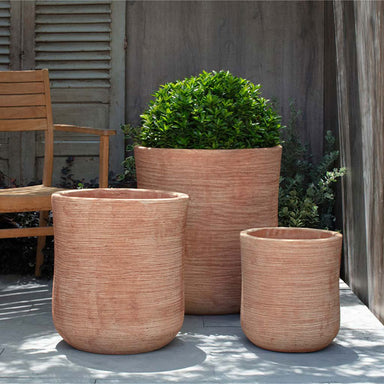 Aspen Planter - Terra Cotta - S/3 on concrete filled with plants