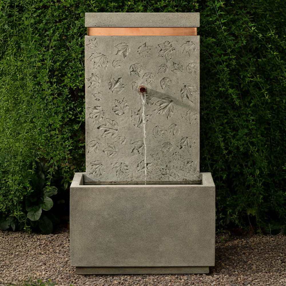 Autumn Sonata Wall Fountain on gravel in action.