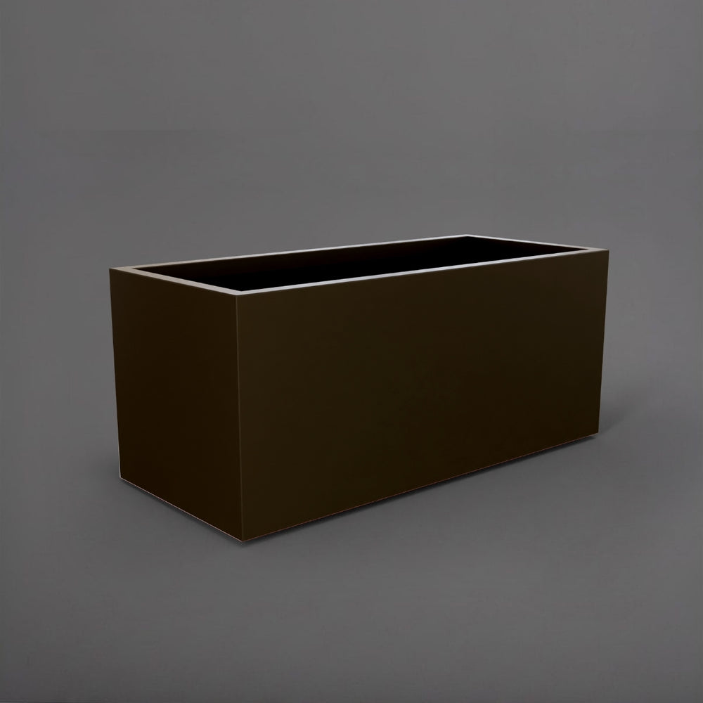 Badalona Rectangle Fiberglass Planter in matte bronze against gray background.