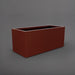 Badalona Rectangle Fiberglass Planter in matte terra cotta against gray background.