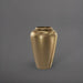 Bara Jar Tall Tapered Fiberglass Planter in gloss metallic gold against gray background.