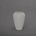 Bara Jar Tall Tapered Fiberglass Planter in matte cement grey against gray background.