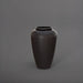 Bara Jar Tall Tapered Fiberglass Planter in matte charcoal against gray background.