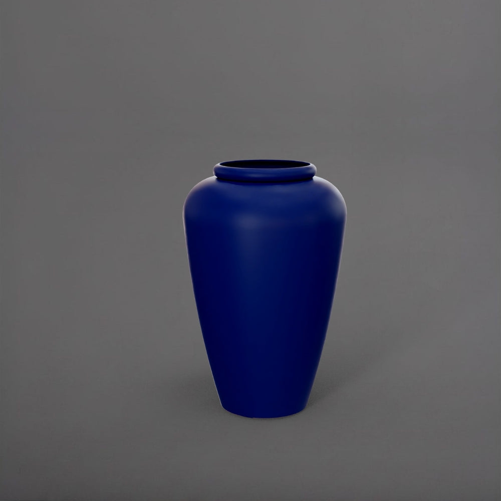 Bara Jar Tall Tapered Fiberglass Planter in matte cobalt blue against gray background.