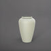 Bara Jar Tall Tapered Fiberglass Planter in satin beige against gray background.