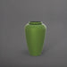 Bara Jar Tall Tapered Fiberglass Planter in satin green against gray background.