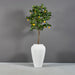 Bara Jar Tall Tapered Fiberglass Planter on concrete filled with plants.