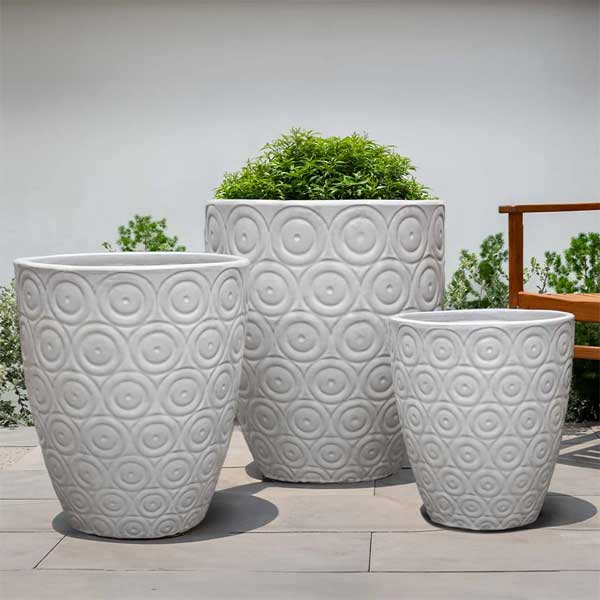 Benicio Planter - Antique White - S/3 on concrete filled with plants