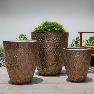 Benicio Planter - Bronze - S/3 on concrete filled with plants