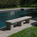 Biscayne Bench on concrete beside swimming pool sideview