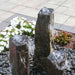 Bowled Top Basalt Fountain Kit on black pebbles in action