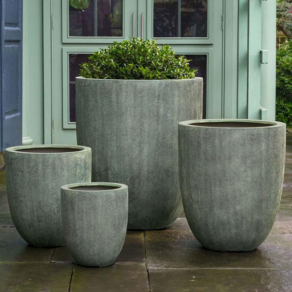 Bradford Planter, Large - Verdigris Lite S/1 on concrete filled with plants