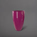 Brannan Tapered Round Fiberglass Planter in gloss eggplant against gray background.