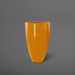 Brannan Tapered Round Fiberglass Planter in gloss tangerine against gray background.