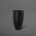 Brannan Tapered Round Fiberglass Planter in matte black against gray background.