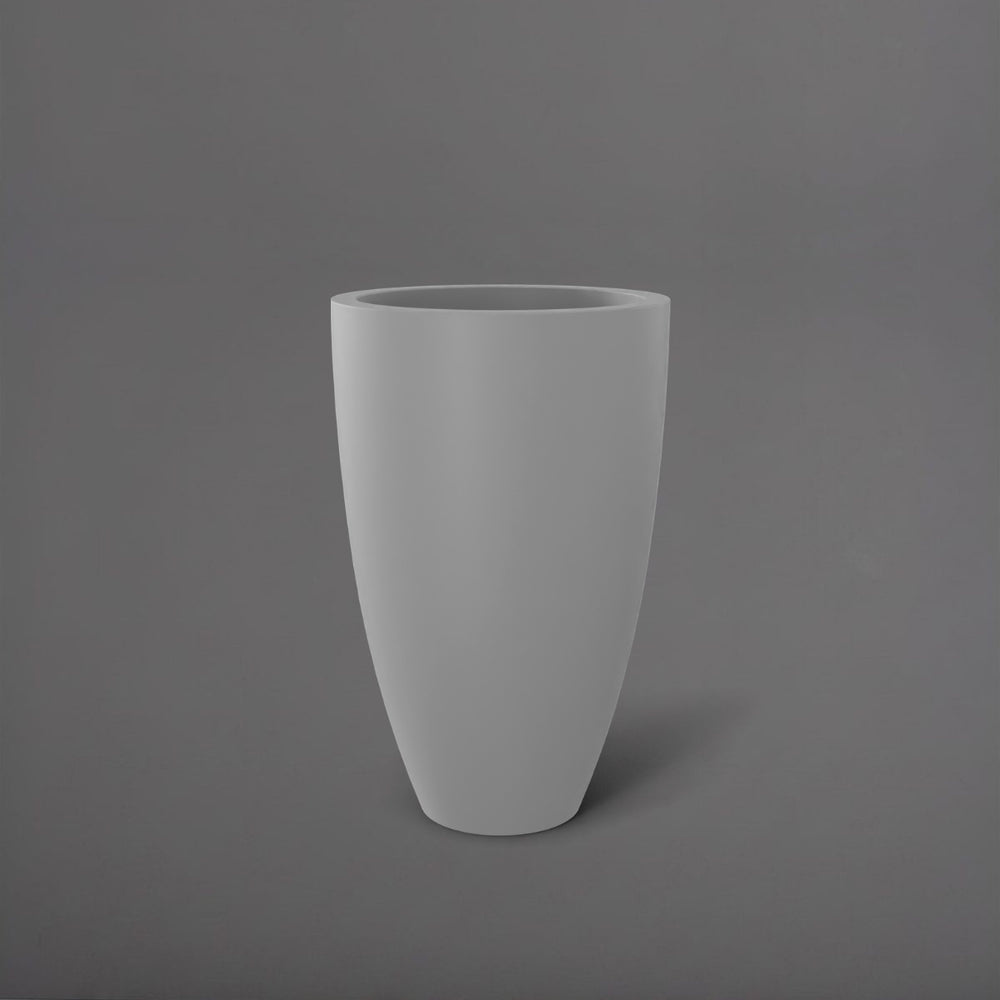 Brannan Tapered Round Fiberglass Planter in matte cement grey against gray background.