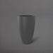 Brannan Tapered Round Fiberglass Planter in matte gunmetal against gray background.