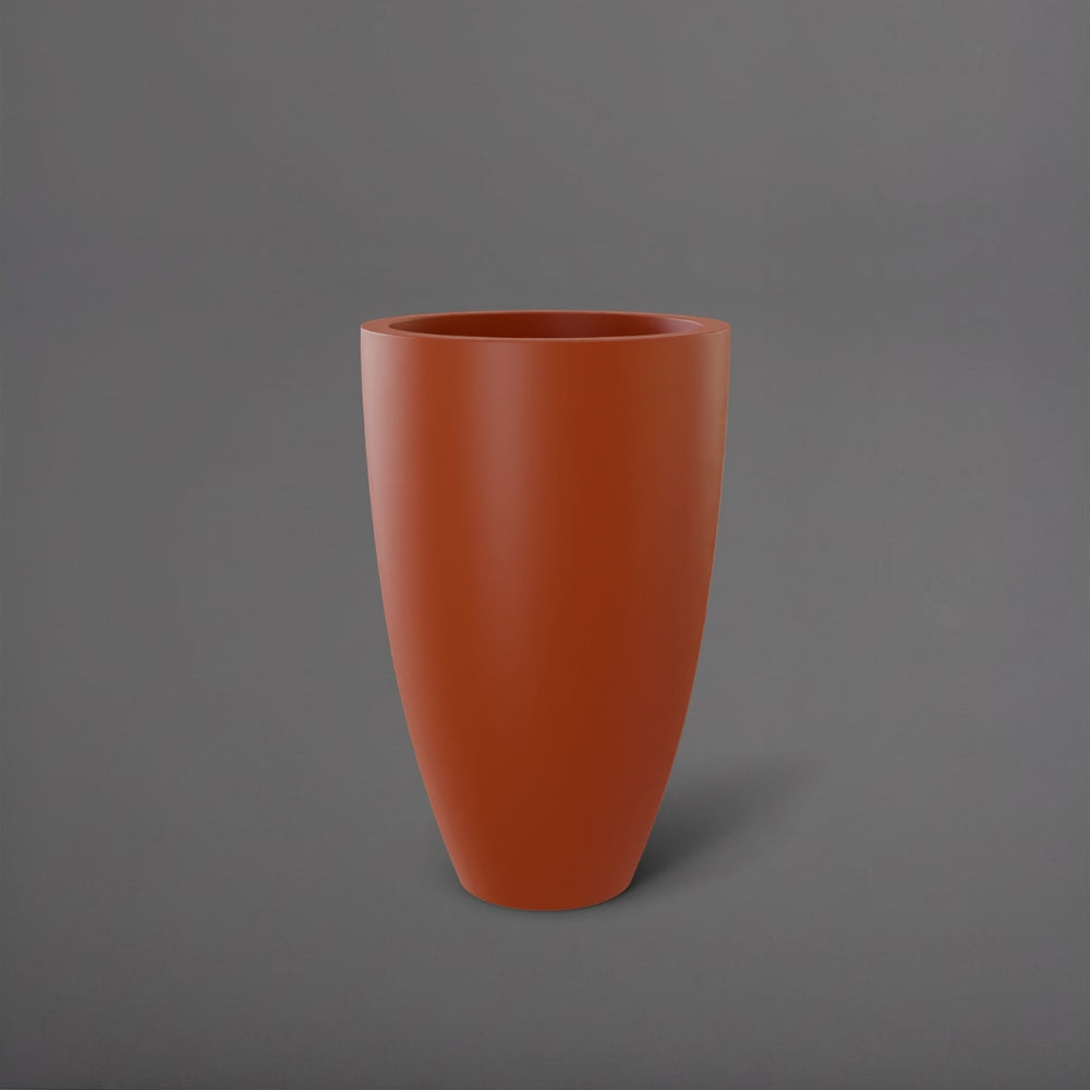 Brannan Tapered Round Fiberglass Planter in matte terra cotta against gray background.