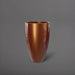 Brannan Tapered Round Fiberglass Planter in metallic bronze against gray background.