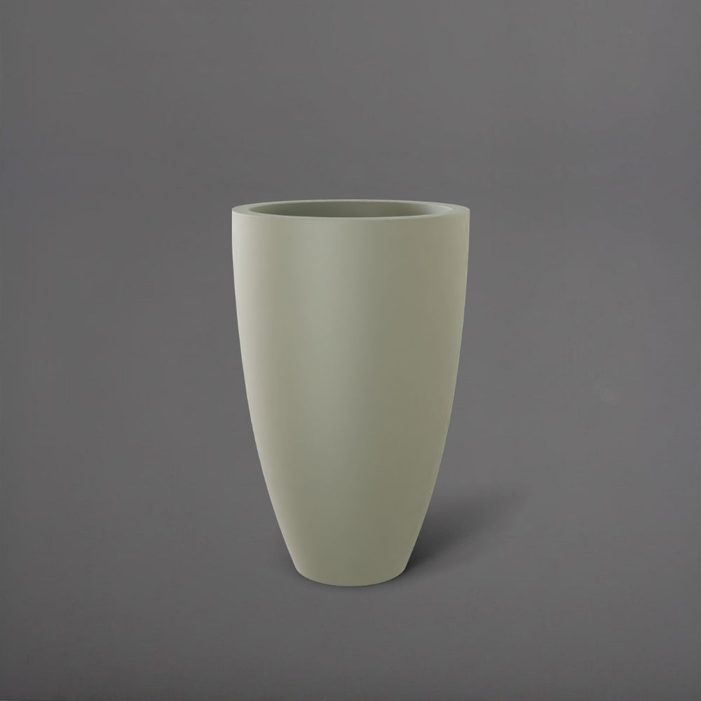 Brannan Tapered Round Fiberglass Planter in satin beige against gray background.