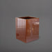 Brisane Tall Corner Fiberglass Planter in metallic bronze against gray background.