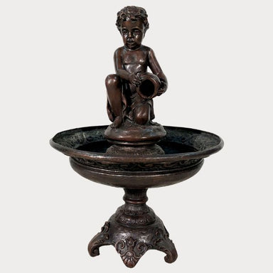 Bronze Boy with jar tray fountain against gray background