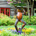 Bronze frog holding lily pad fountain in the backyard