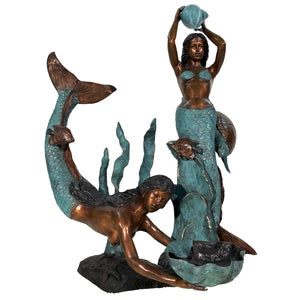 Bronze Mermaids in sea fountain sculpture against white backdrop