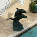 Bronze Three Dolphins Fountain Sculpture in action on the swimming pool upclose.