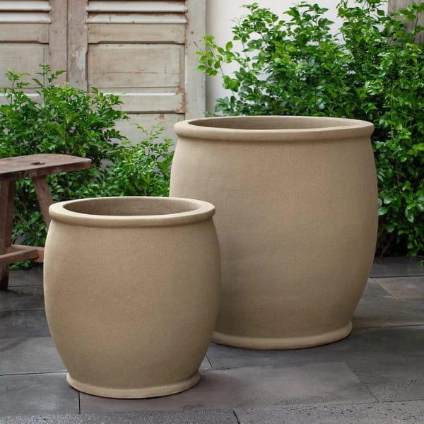 Brooke Planter in dune color on concrete in the backyard.