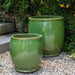 Brooke Planter in erin green color on concrete in the backyard,.