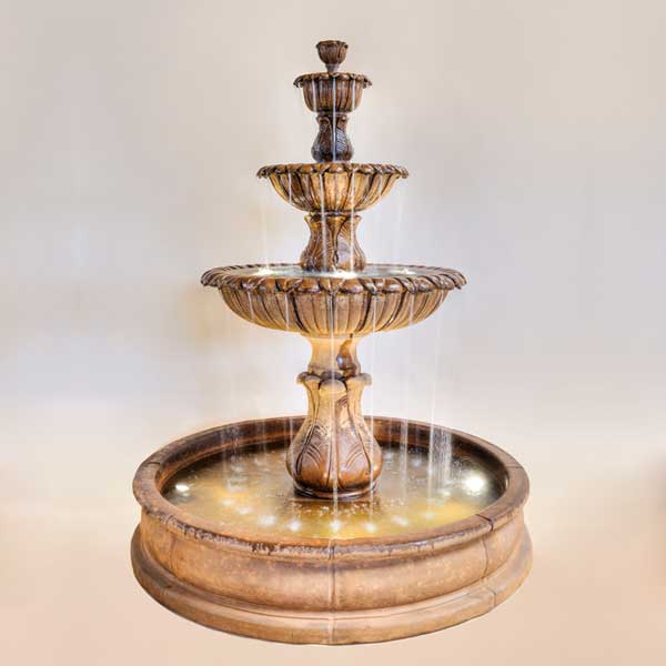 Calanthia Three Tier Pond Fountain against brown backbround.