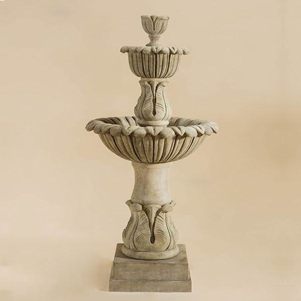 Calanthia Two Tier Fountain against brown background.