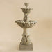 Calanthia Two Tier Fountain against brown background.
