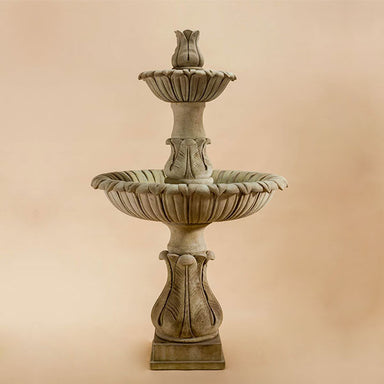 Calanthia Two tier with Lotus Finial against brown background.